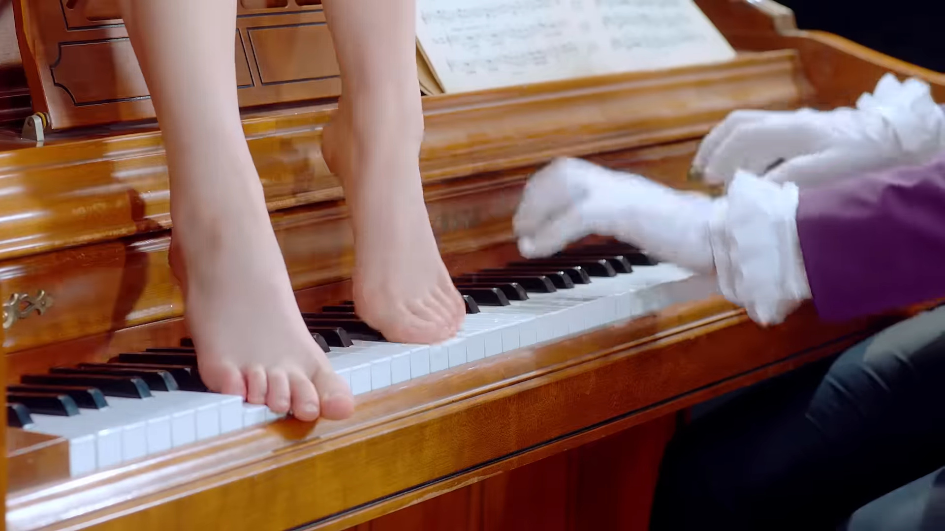 Yeojin playing the piano with her bare feet.